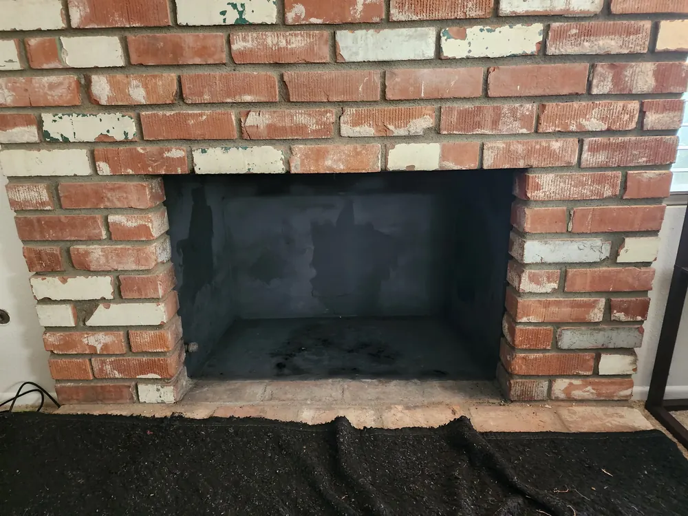 Brick firebox before fireplace service