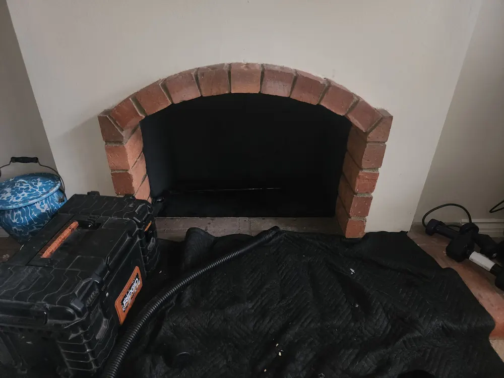 Arched fireplace after the firebox was cleaned